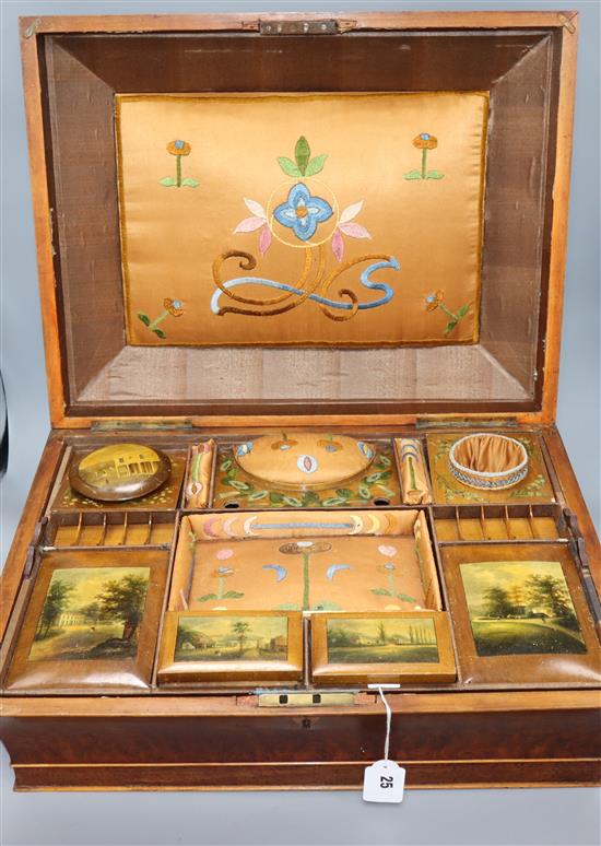 An early 19th century French amboyna work box with painted panel and embroidered lidded interior